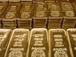 Gold prices fall amid Fed tapering concerns in choppy trading