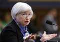 Fed keeps key interest rate steady but sees fewer risks