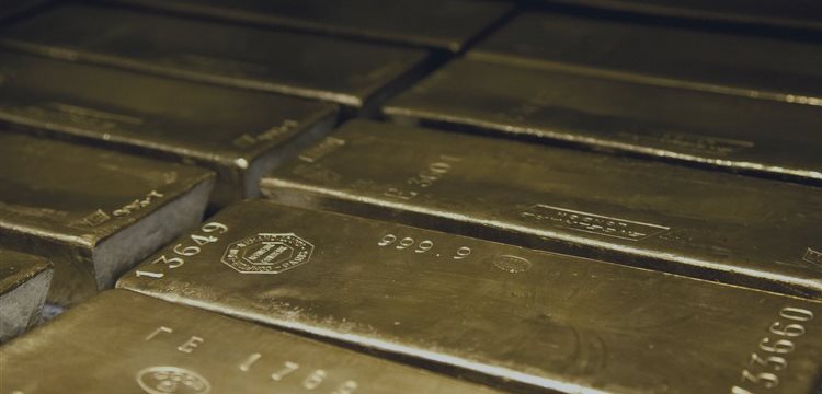 Gold pulls back from 2-week high; silver drops