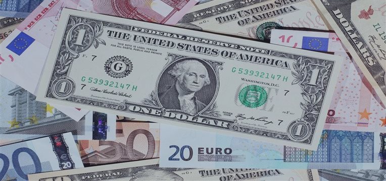 Dollar reaches one-week high vs euro after Fed officials' comments