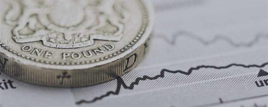 Downbeat U.K. data sends sterling lower, damps hopes for U.K. rate hike