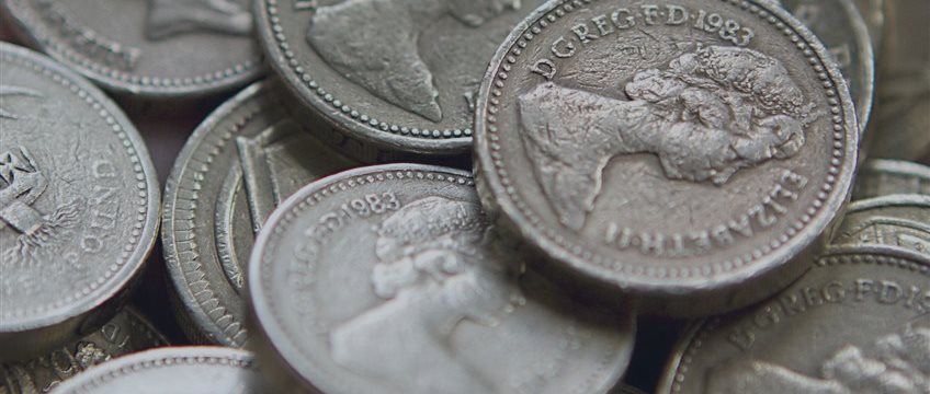 Sterling surges on upbeat U.K. data