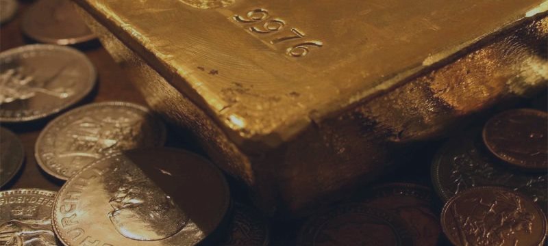 Gold hits four-week lows, U.S. PMI ahead