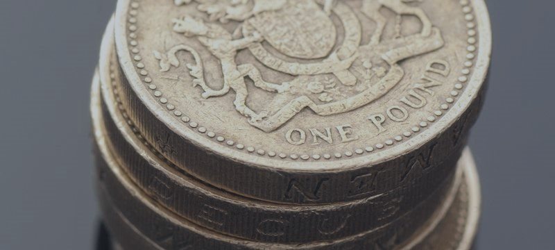 Pound higher on strong U.K. data