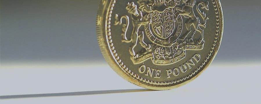 Pound slightly changed after disappointing data from U.K.